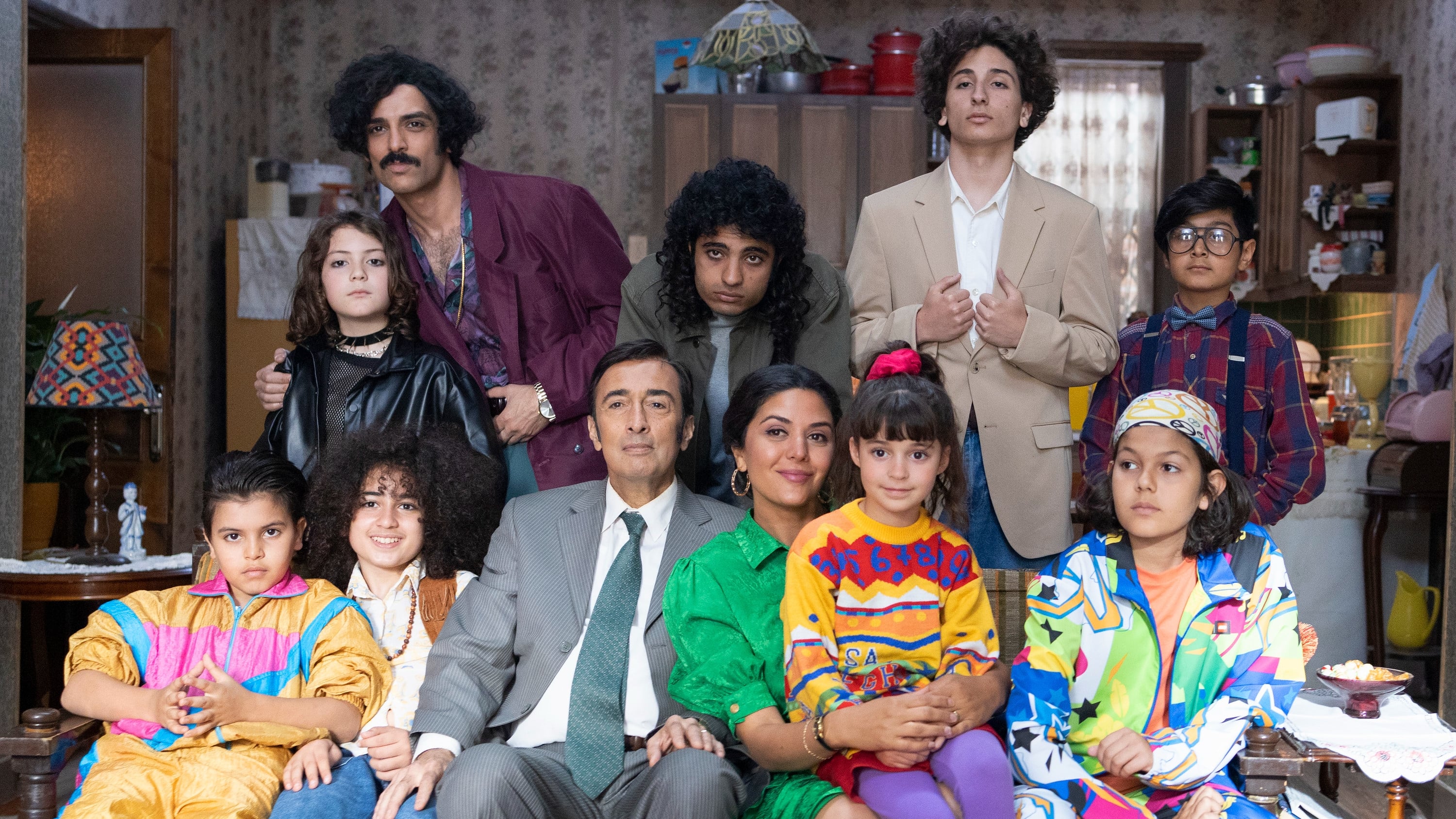 Still from The Persian Version: A large family gathered for a photo
